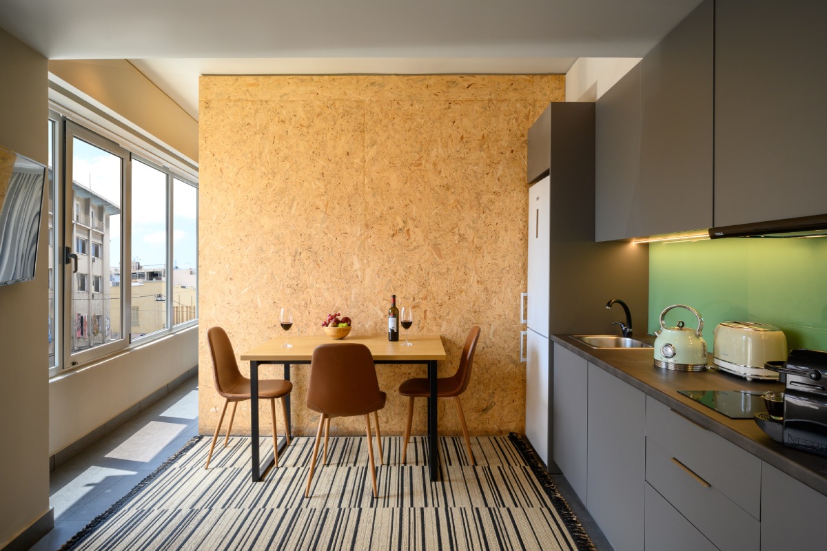 Kitchen area with dining table at Psiri Vibes Superior Panaromic Triple Suite